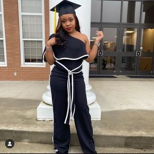 Two piece jumpsuit one shoulder with belt.